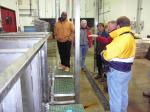 Mike Erickson explains some of the equipment to visiting North Carolina shrimpers at Alaska Glacier Seafoods in Juneau.